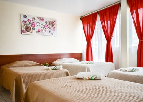 Quadruple Room, Balcony | In-room safe, desk, free WiFi, bed sheets