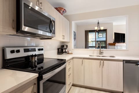 Condo, 2 Bedrooms (Unit 125) | Private kitchen | Full-size fridge, microwave, oven, stovetop