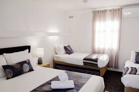 Family Triple Room, Multiple Beds, Non Smoking | Premium bedding, blackout drapes, WiFi, bed sheets