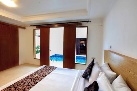 Family Double Room, 3 Bedrooms, Pool View | Minibar, in-room safe, desk, iron/ironing board