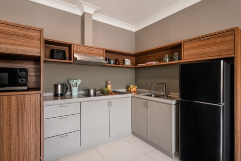 Premier Room, 2 Bedrooms | Private kitchen | Fridge, microwave, stovetop, coffee/tea maker