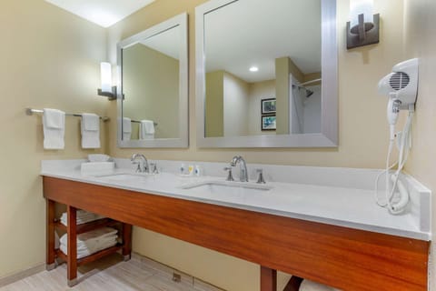 Suite, 2 Queen Beds, Non Smoking | Bathroom | Rainfall showerhead, free toiletries, hair dryer, towels