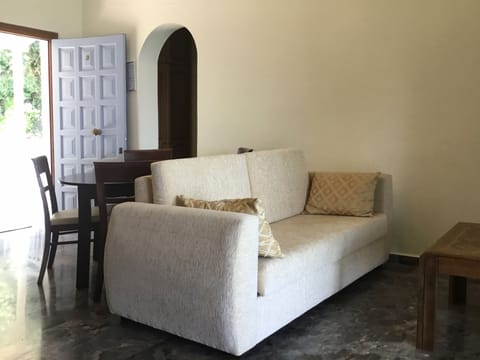 Apartment, 1 Bedroom, Sea View (03) | Living area | Flat-screen TV
