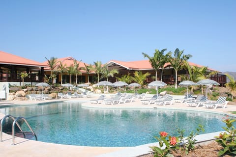 Outdoor pool, open 7:00 AM to 7:00 PM, free cabanas, pool umbrellas