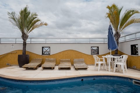 Outdoor pool, open 9:00 AM to 11:00 PM, pool umbrellas, sun loungers