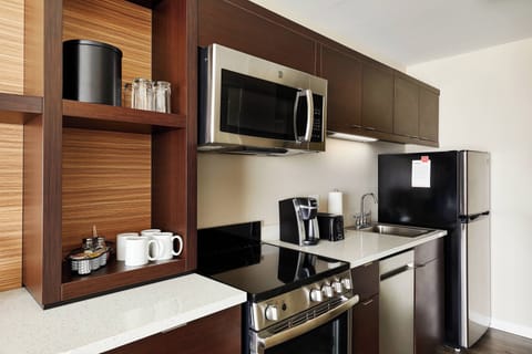 Suite, 1 Bedroom | Desk, laptop workspace, blackout drapes, iron/ironing board