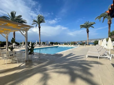 Seasonal outdoor pool, pool umbrellas, sun loungers