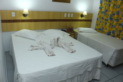 Economy Triple Room, Non Smoking | Minibar, blackout drapes, free WiFi, bed sheets