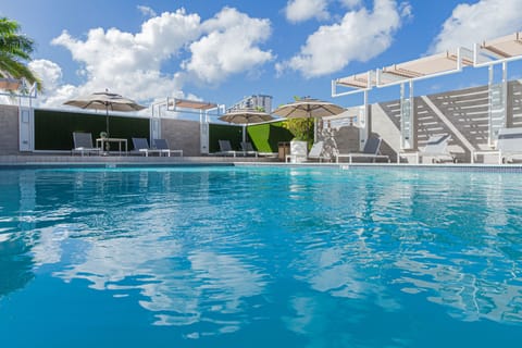 Outdoor pool, open 8:00 AM to 8:00 PM, pool umbrellas, sun loungers