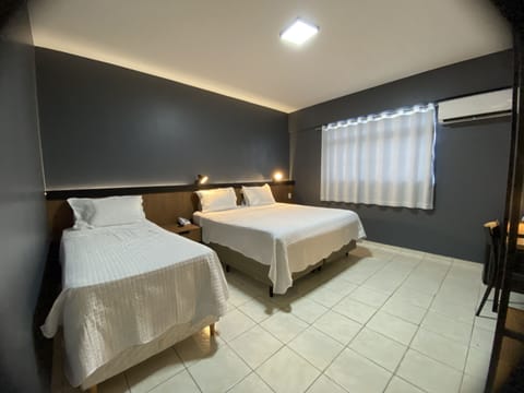 Triple Room, Non Smoking | Minibar, free WiFi, bed sheets