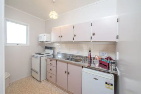 Suite, 1 Bedroom | Private kitchen | Fridge, microwave, stovetop, coffee/tea maker