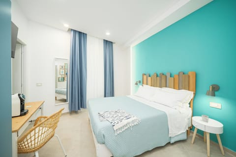 Deluxe Room, 1 Queen Bed, Private Bathroom, City View | Individually furnished, desk, soundproofing, free cribs/infant beds