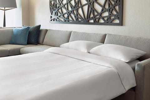 Premium bedding, down comforters, pillowtop beds, in-room safe