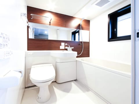 Combined shower/tub, hair dryer, slippers, electronic bidet