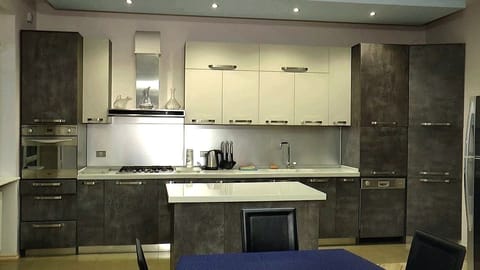 Villa | Private kitchen | Fridge, microwave, oven, stovetop