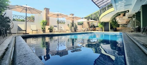 Outdoor pool, open 9:00 AM to 9:00 PM, sun loungers