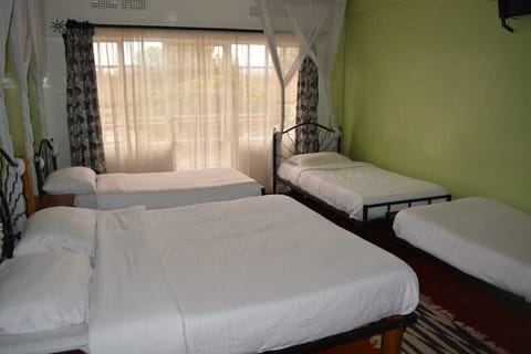 Quadruple Room, Multiple Beds, Private Bathroom | Premium bedding, desk, laptop workspace, iron/ironing board