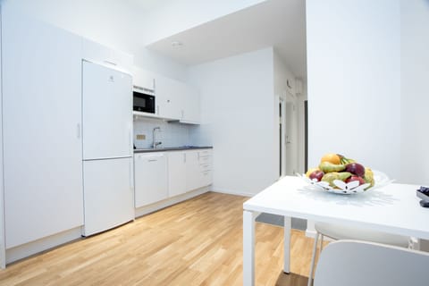 Studio, 1 Queen Bed | Private kitchen | Full-size fridge, microwave, stovetop, dishwasher