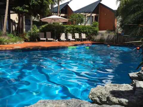 Outdoor pool, pool umbrellas, sun loungers