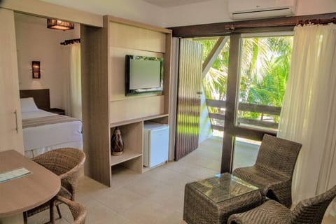 Deluxe Suite (Seafront With Balcony) | Minibar, in-room safe, desk, blackout drapes