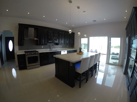 Luxury Villa, Multiple Beds, Ocean View | Shared kitchen | Full-size fridge, microwave, oven, stovetop