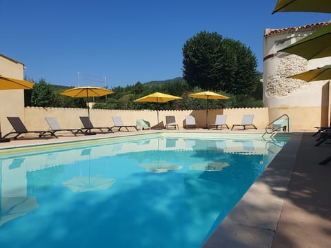 Seasonal outdoor pool, open 9:30 AM to 7:30 PM, pool umbrellas