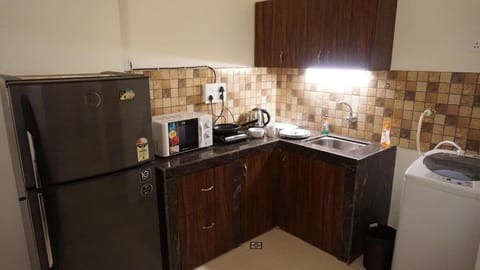 Fridge, microwave, toaster, cookware/dishes/utensils