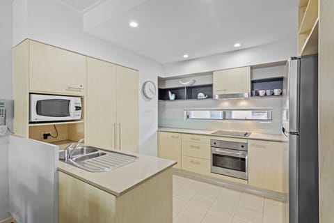 Deluxe Two Bedroom Apartment | Private kitchen | Full-size fridge, microwave, stovetop, dishwasher