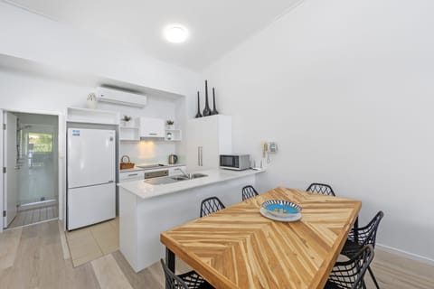 Deluxe One Bedroom Apartment | Private kitchen | Full-size fridge, microwave, stovetop, dishwasher