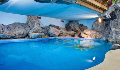 Indoor pool, seasonal outdoor pool, pool umbrellas, sun loungers