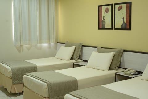 Deluxe Triple Room, Multiple Beds | Minibar, in-room safe, blackout drapes, free WiFi