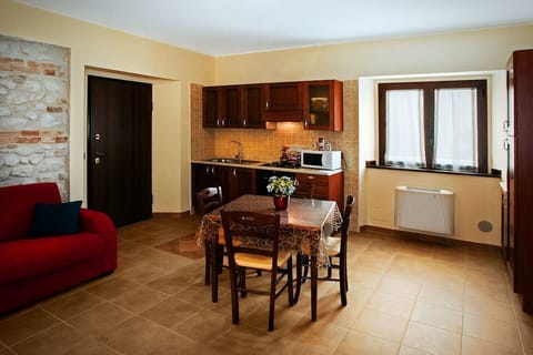 Superior Studio Suite, 1 Bedroom (La Piuma Rossa) | Private kitchen | Fridge, microwave, stovetop, cookware/dishes/utensils