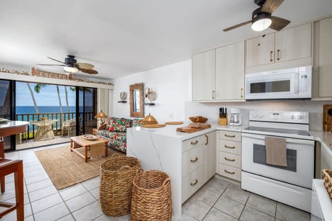 Condo, 1 King Bed (Kona Isle E23) | Private kitchen | Fridge, microwave, stovetop, dishwasher