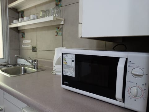 Apartment | Private kitchen | Mini-fridge, microwave, electric kettle, cookware/dishes/utensils