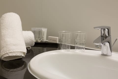 Economy Double Room | Bathroom | Hair dryer, slippers, towels