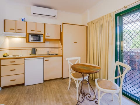 Deluxe Studio, 1 Queen Bed, Pool View - Not Pet Friendly | Private kitchen | Electric kettle, toaster, blender, griddle