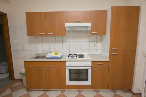 Apartment, Balcony | Private kitchen | Fridge, stovetop, coffee/tea maker, electric kettle