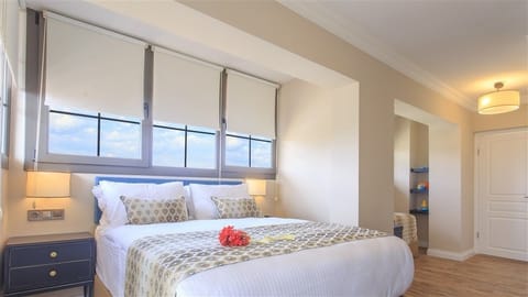 Family Room, Partial Sea View | 1 bedroom, in-room safe, desk, iron/ironing board