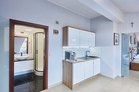 Suite | Private kitchenette | Fridge, stovetop, electric kettle, highchair