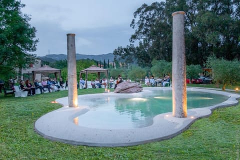 Seasonal outdoor pool, open 9:00 AM to 7:00 PM, pool umbrellas