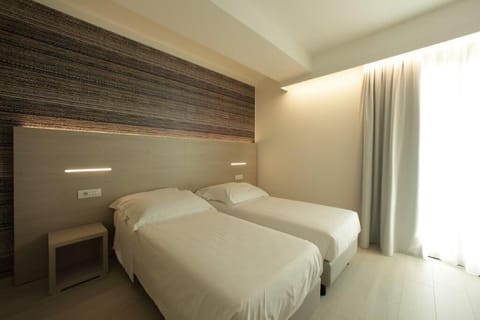 Double or Twin Room, Balcony, Partial Lake View | Minibar, in-room safe, desk, laptop workspace