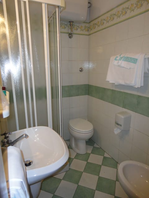 Shower, designer toiletries, hair dryer, bidet