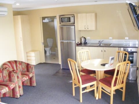 Executive One-Bedroom Unit | Private kitchen | Fridge, microwave, stovetop, coffee/tea maker