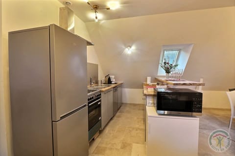 Apartment, 2 Bedrooms (Le SIX) | Private kitchen | Highchair