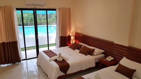 Deluxe Triple Room, 2 Bedrooms, Pool Access, Poolside | Desk, free WiFi, bed sheets