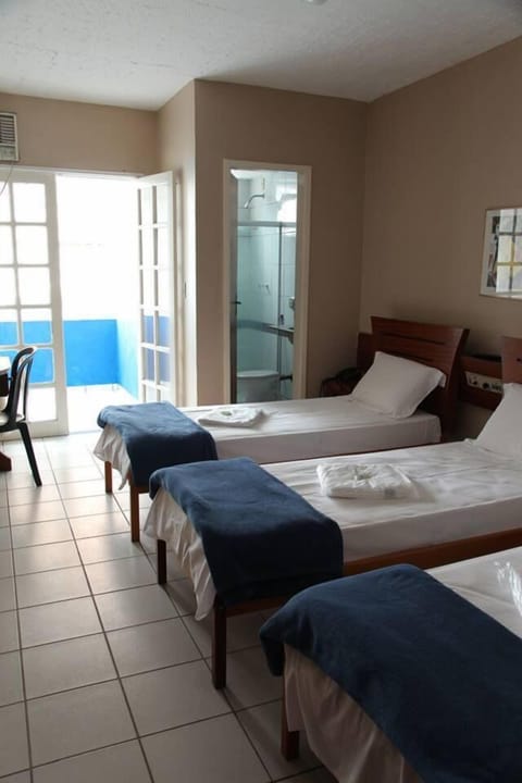 Triple Room, Multiple Beds | Minibar, desk, blackout drapes, free WiFi