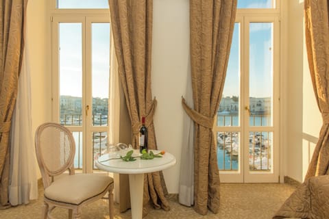 Junior Suite, Balcony, Sea View | Minibar, in-room safe, desk, free WiFi