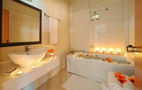 Family Suite, Sea View (Sunset) | Bathroom | Shower, free toiletries, hair dryer, slippers