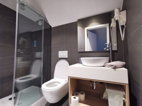 Triple Room | Bathroom | Shower, hair dryer, towels, soap