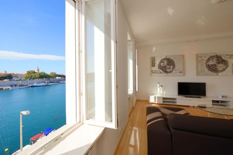 Luxury Apartment, 2 Bedrooms, Sea View | Living area | 139-cm flat-screen TV with satellite channels, Smart TV